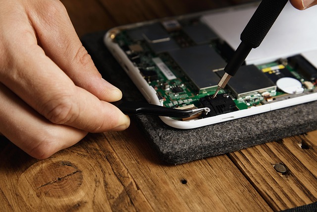 solar panel technician performing maintenance on rooftop array with safety equipment